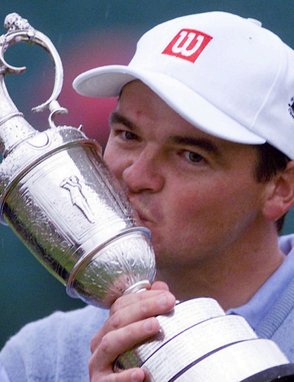 Paul Lawrie swinging Scottish links course, championship golf links fairway Scotland, luxury golf experience with Paul Lawrie, group tee shot with Open champion, private golf day Scottish links, clubhouse at championship golf course, links course dunes and green view, on-course coaching with Paul Lawrie, golf memorabilia signed keepsake, top Scottish Open links course