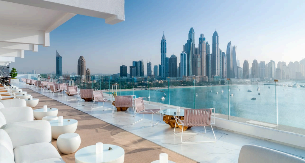 Veuve Clicquot desert dining Dubai, Ferrari desert drive UAE, luxury yacht party Dubai Marina, bespoke Louboutin boutique Dubai, Daymaniyat Islands marine life, Abu Dhabi GP paddock VIP, sunset dune lounge champagne, mega yacht under Dubai skyline