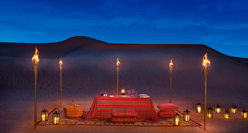 Veuve Clicquot desert dining Dubai, Ferrari desert drive UAE, luxury yacht party Dubai Marina, bespoke Louboutin boutique Dubai, Daymaniyat Islands marine life, Abu Dhabi GP paddock VIP, sunset dune lounge champagne, mega yacht under Dubai skyline